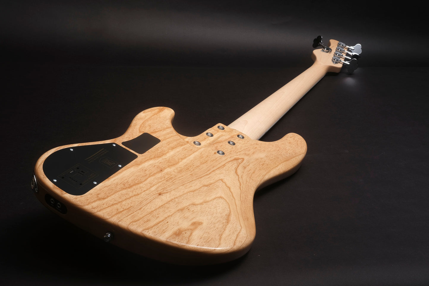 Wooden electric guitar on a black background