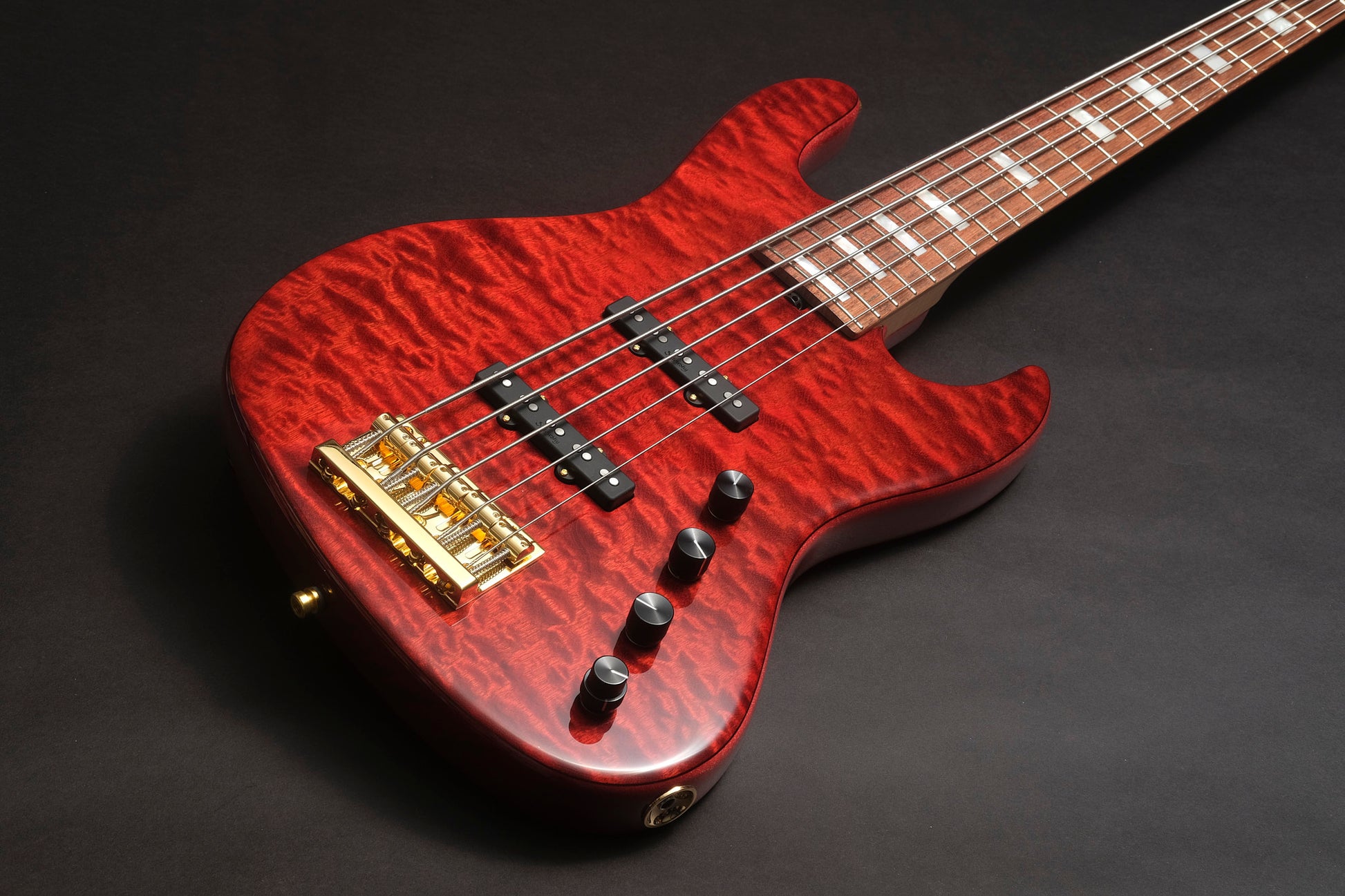 Sadowsky Masterbuilt Ltd Edition 2023 - a red bass 5 strings bass guitar with a figured top and block inlays