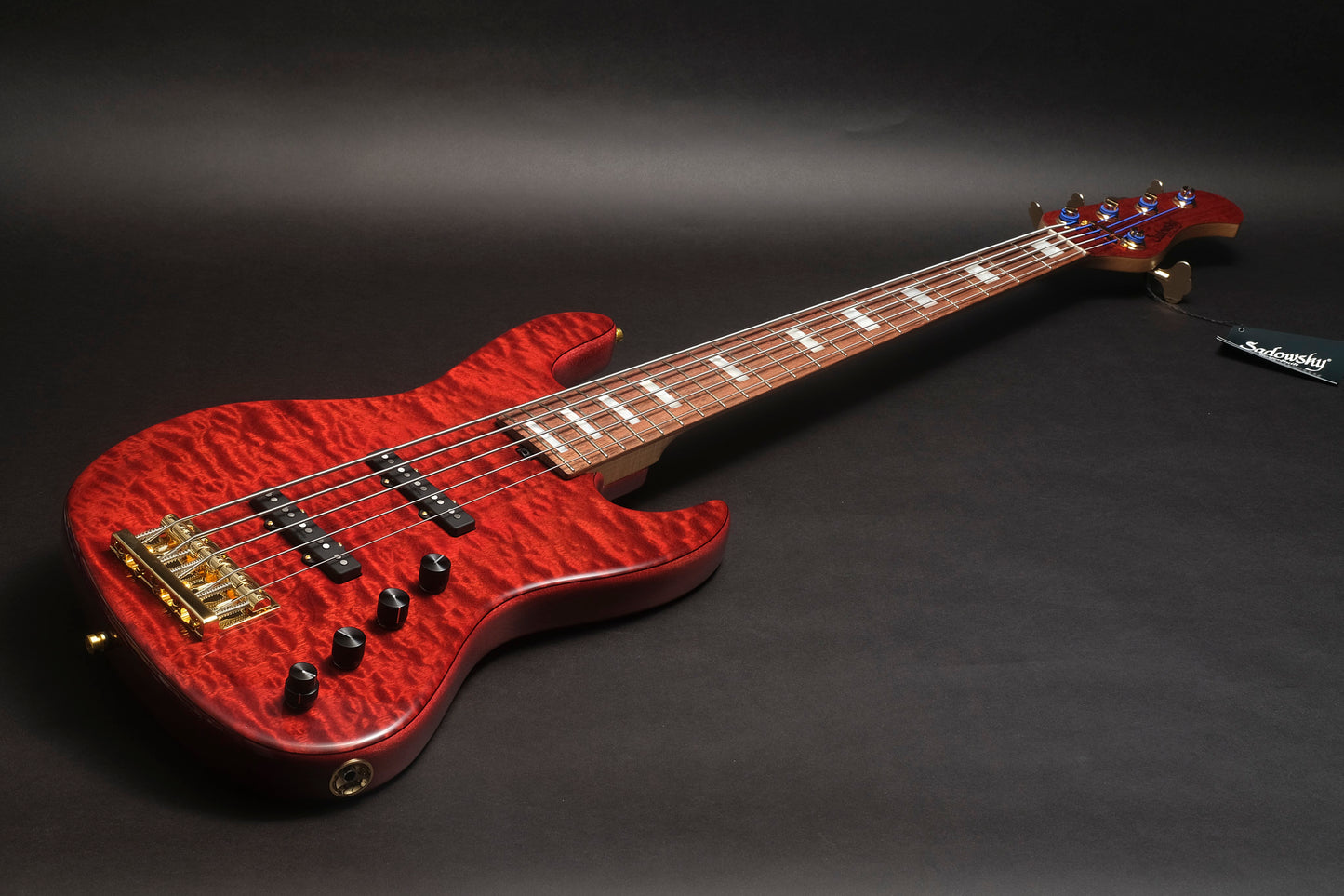 Sadowsky Masterbuilt Ltd Edition 2023 - a red bass 5 strings bass guitar with a figured top and block inlays - full view