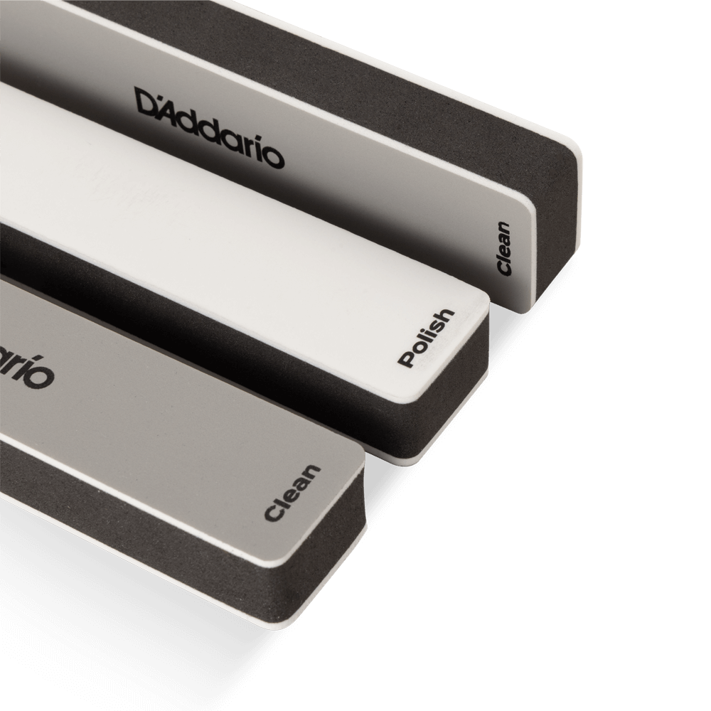 D'Addario slotted fret guard protecting the fingerboard during fret polishing